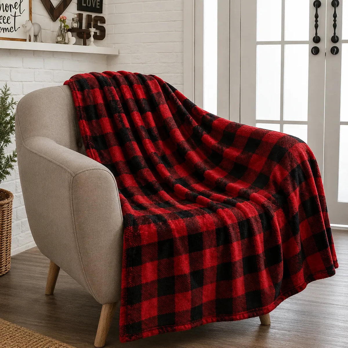 Large check tartan throw in red and black on a sofa